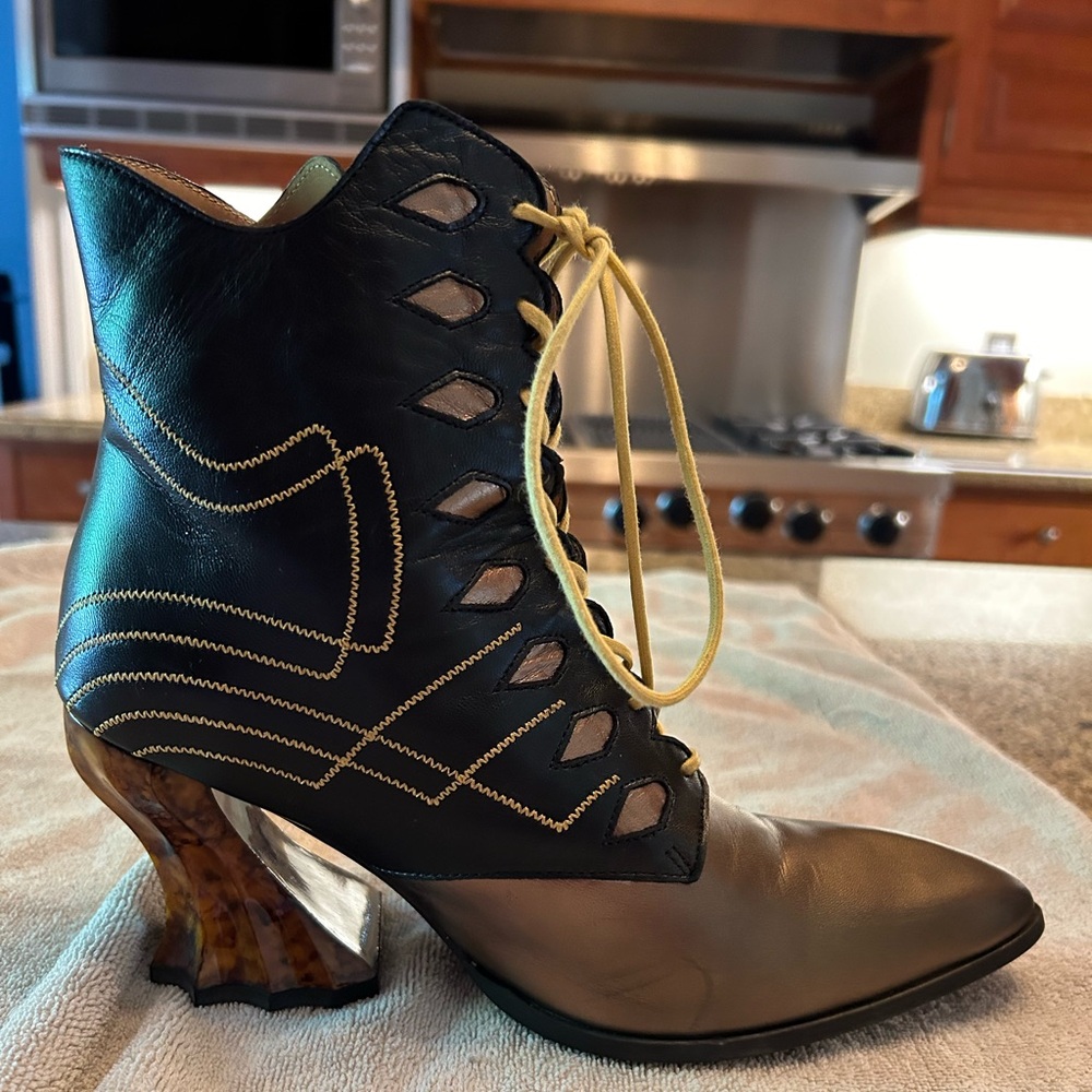 Deliverance Brit gold and black regal ankle boot with stitching John Fluevog